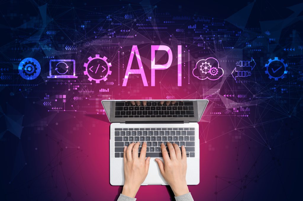 API - application programming interface concept with person using laptop
